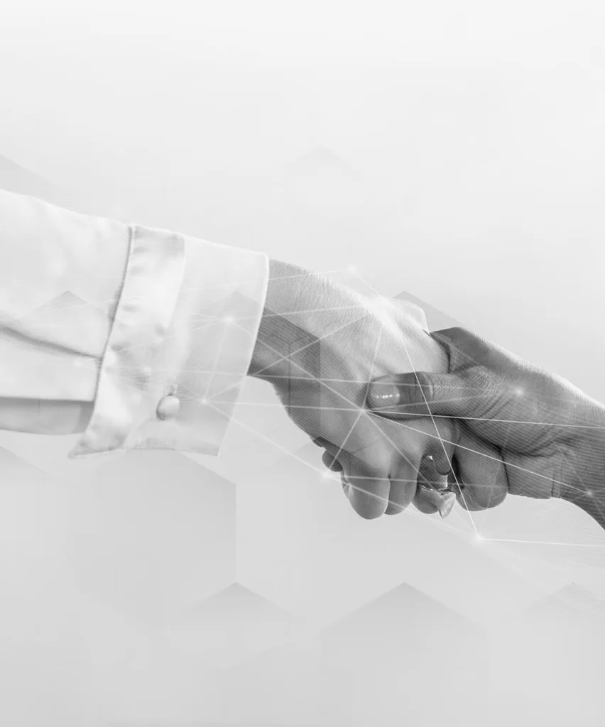 Two professionals shaking hands over a subtle network of connected lines